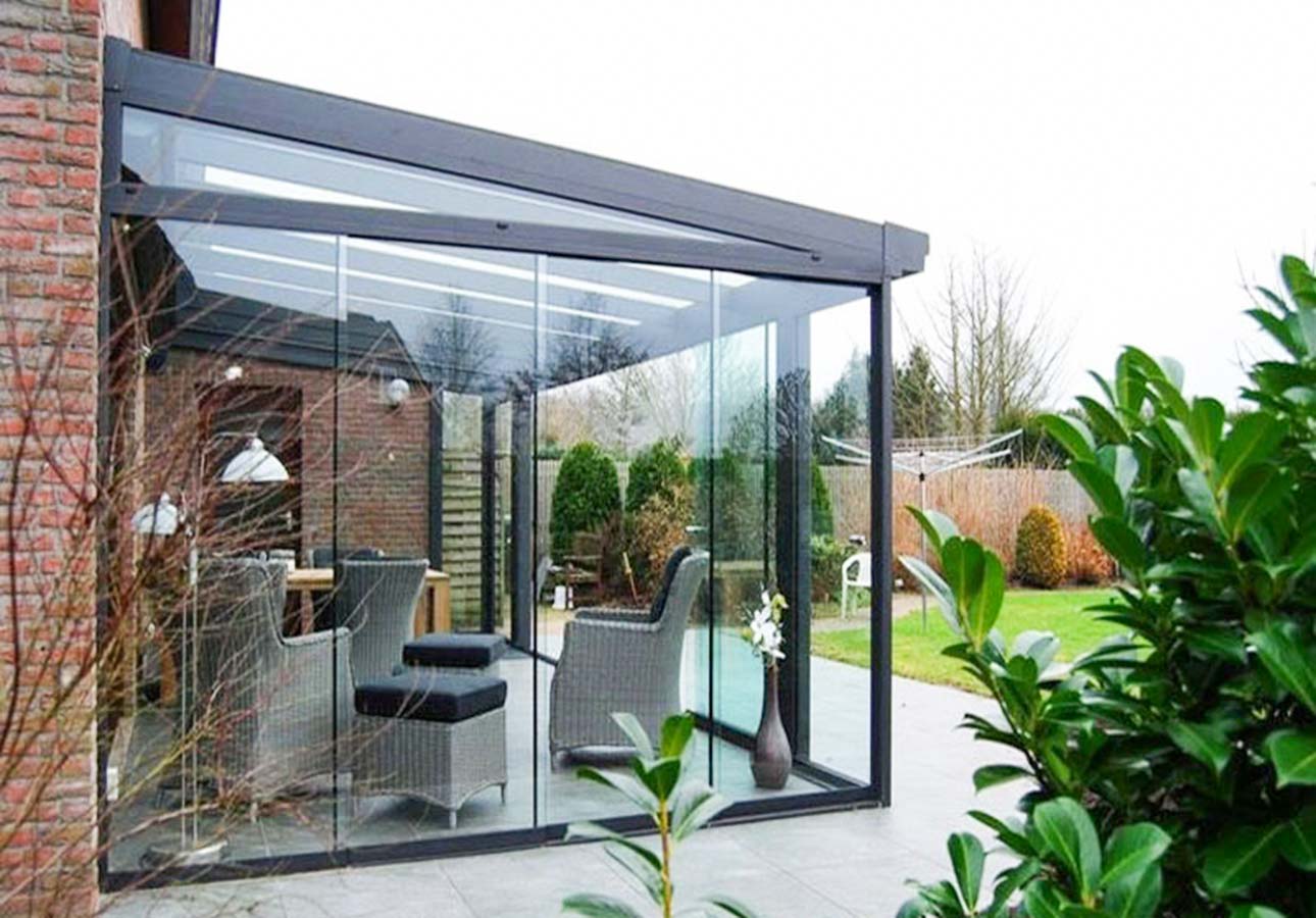 Frameless sliding glass on a planted terrace