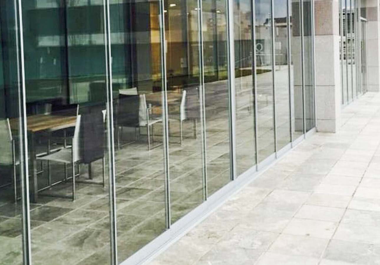 Frameless sliding glass panels on a patio