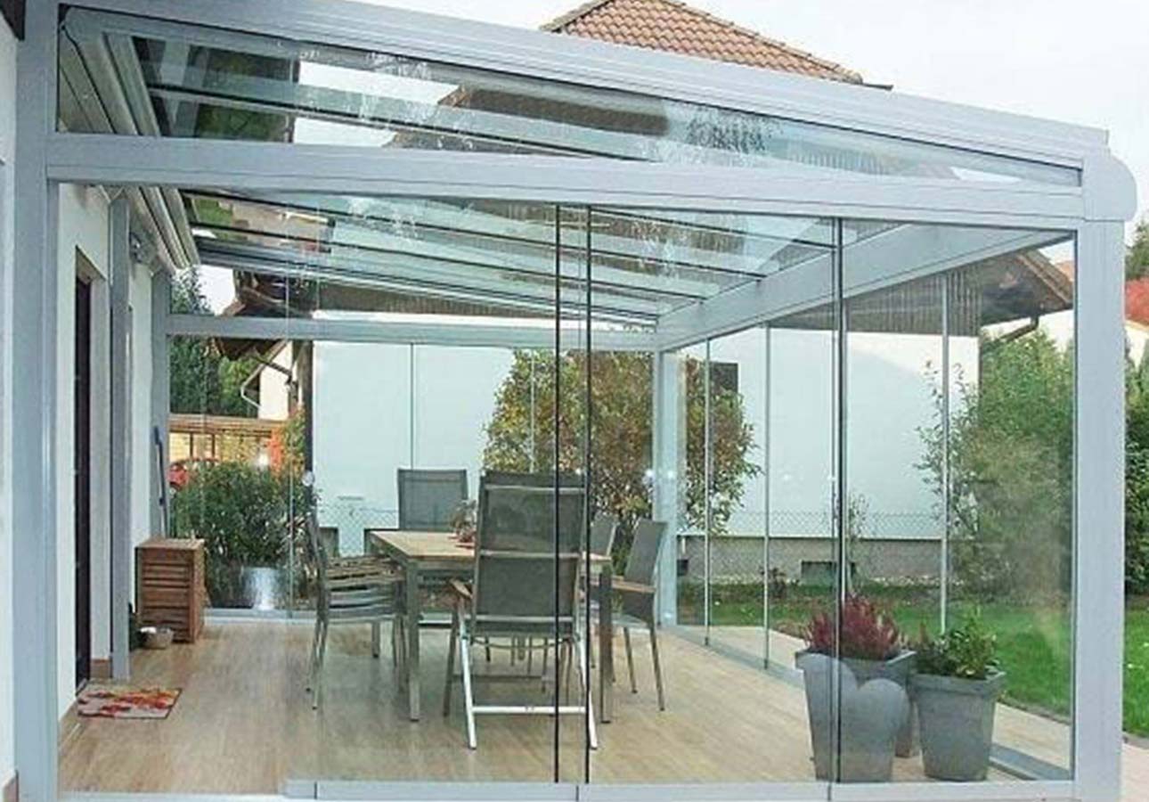 Frameless sliding glass on a garden room extension