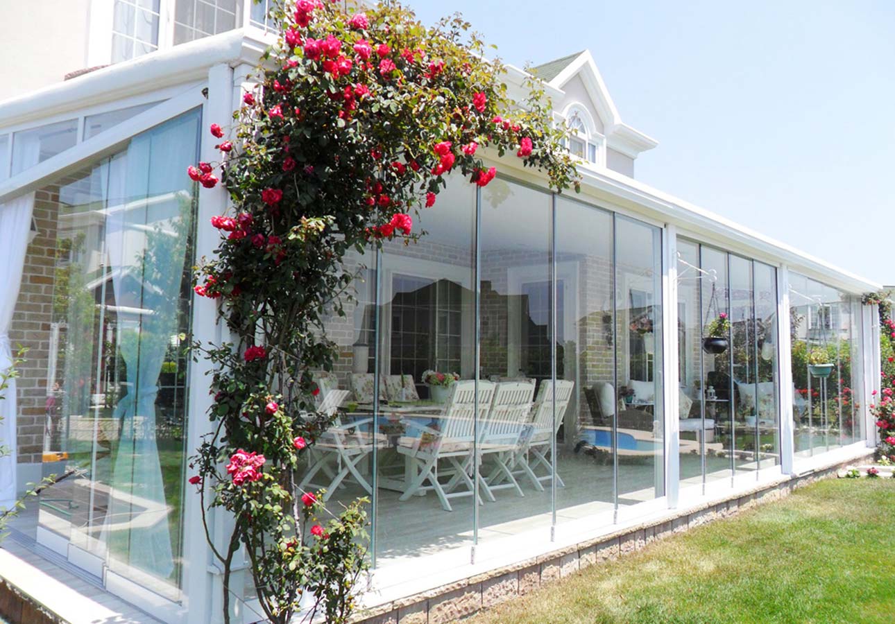 Frameless sliding glass on a planted veranda