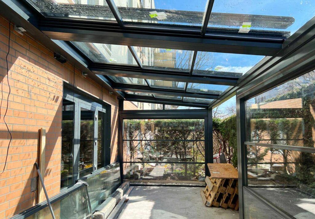 Sleek Retractable Glass Roof Garden Rooms Providing Year-Round Enjoyment in the UK