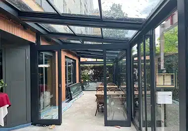 Elegant-Retractable-Glass-Roof-Conservatories-Creating-Stylish-Outdoor-Spaces-in-the-UK