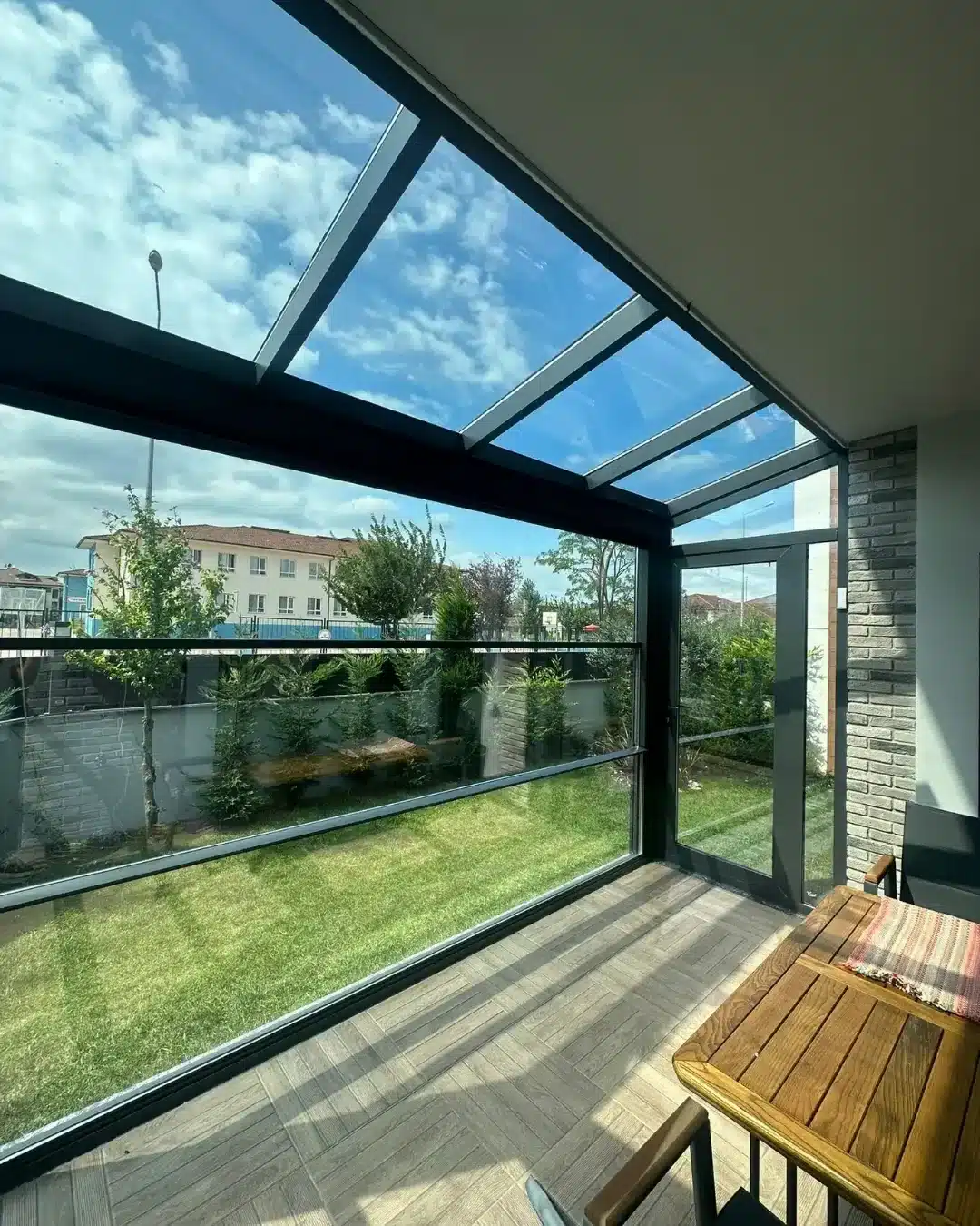 Fixed glass roof garden room with glass walls