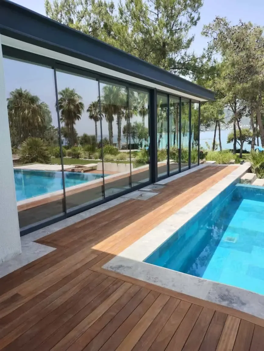 Frameless sliding glass on a pool terrace