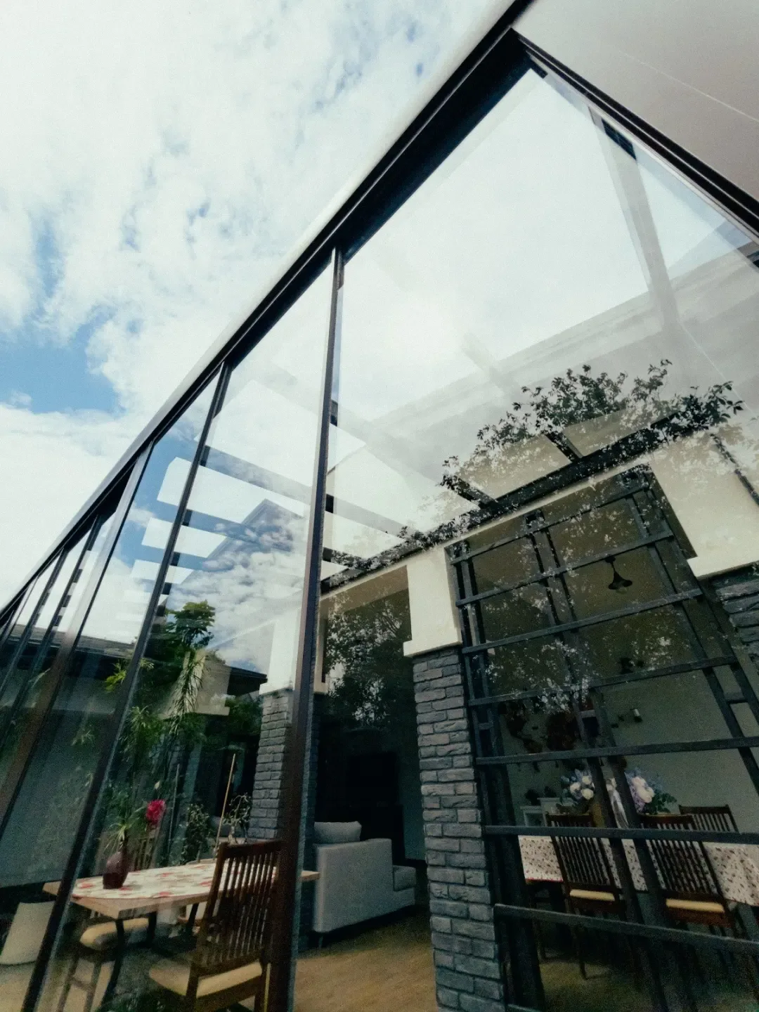 Glass roof extension with sliding glass doors