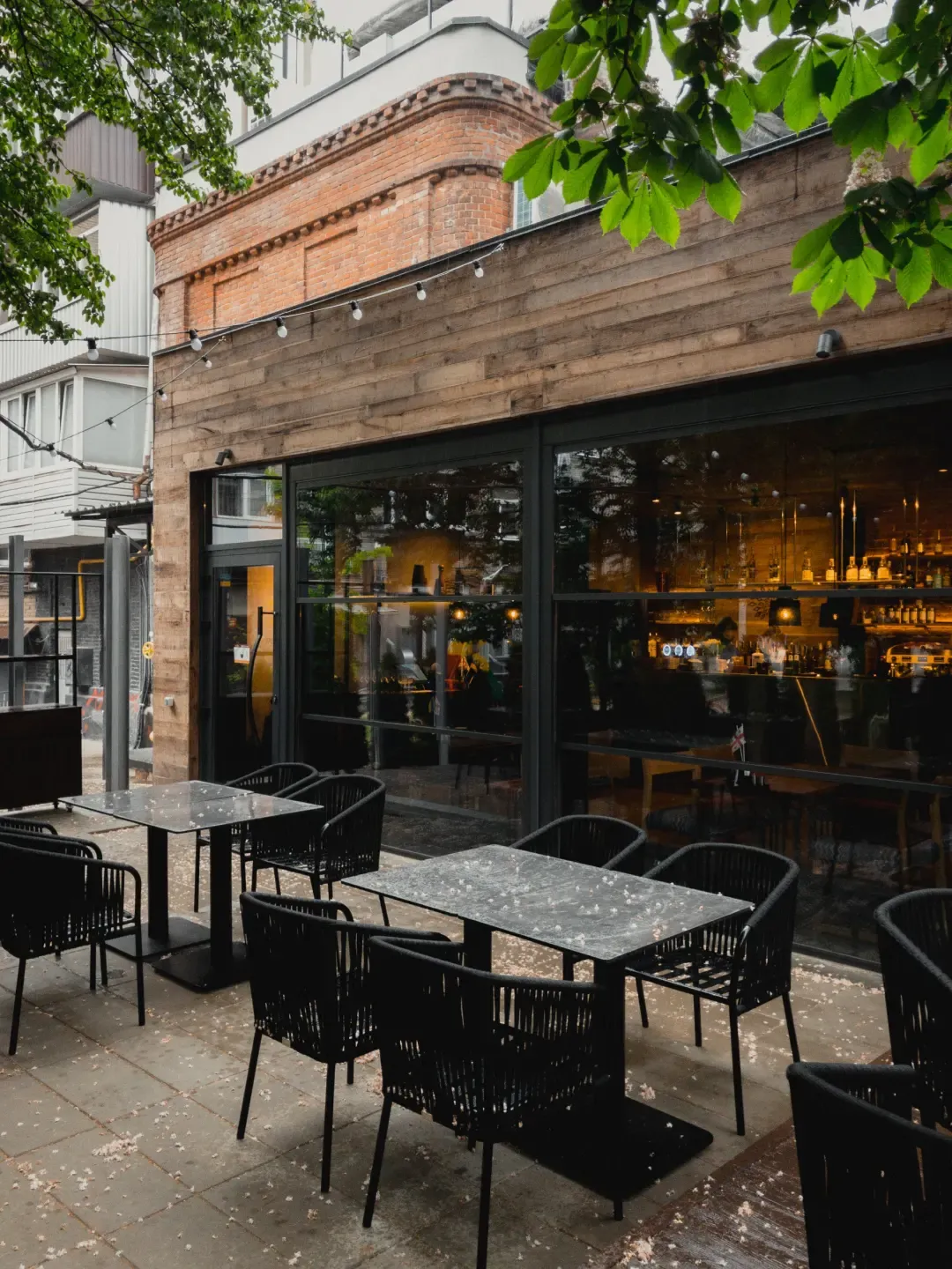 Bar terrace enclosed with guillotine glass