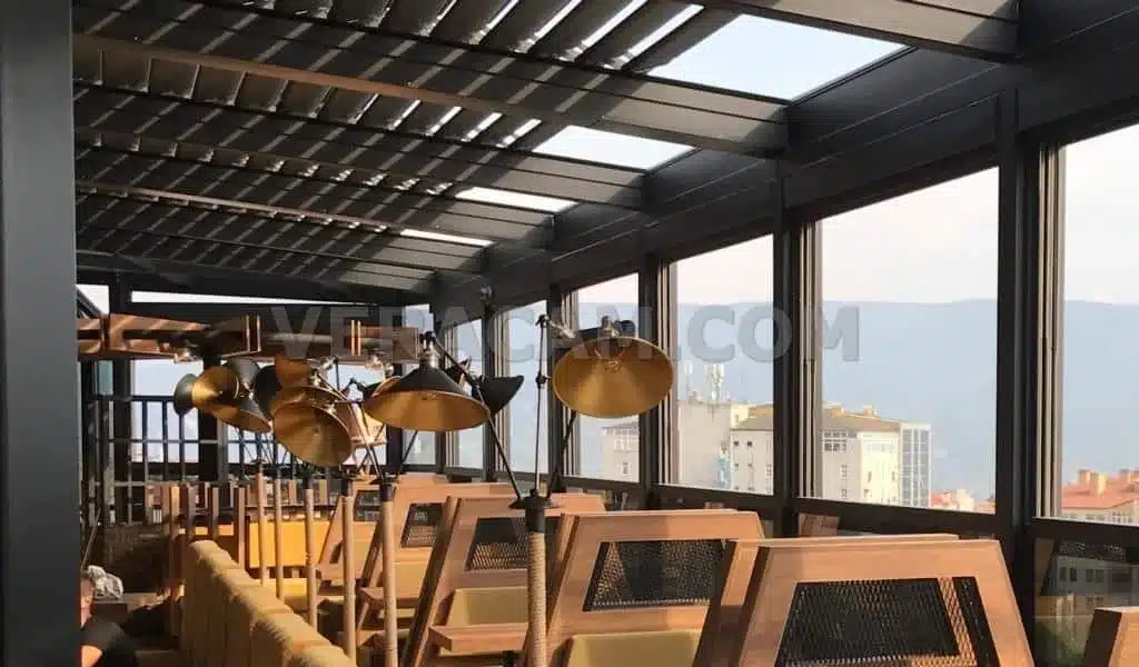Café terrace enclosed with guillotine glass