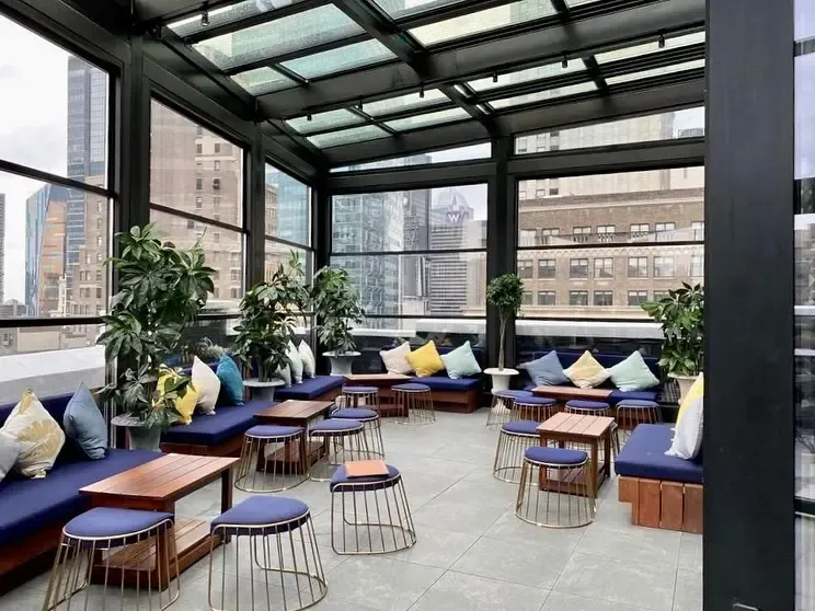 Rooftop lounge terrace enclosed with guillotine glass