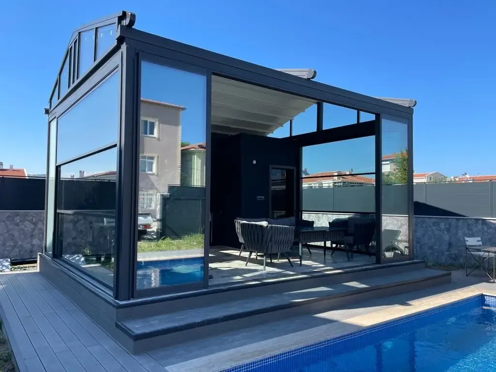 Rooftop pool terrace enclosed with guillotine glass