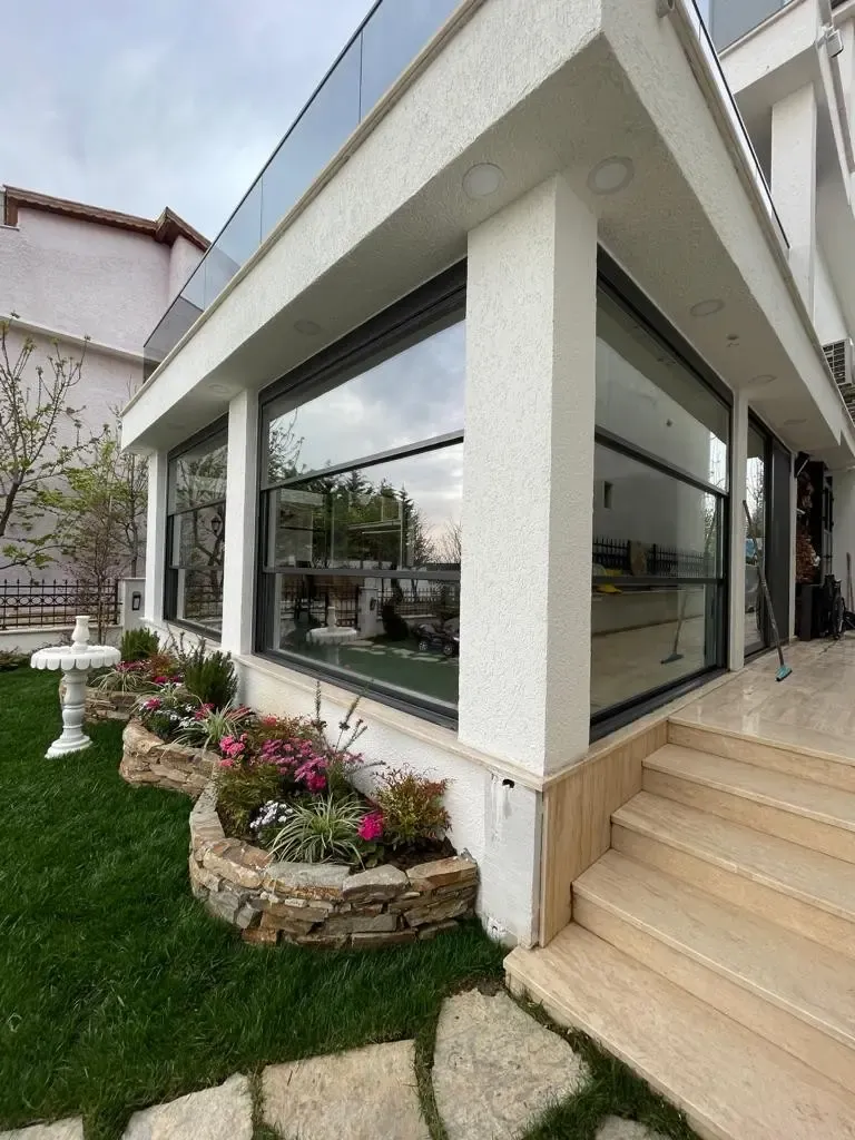 Villa terrace enclosed with guillotine glass