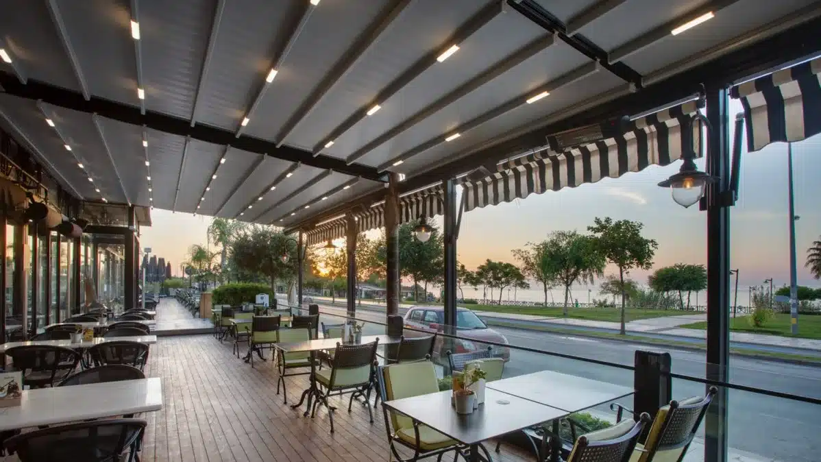 LED-lit pergola awning over waterfront dining