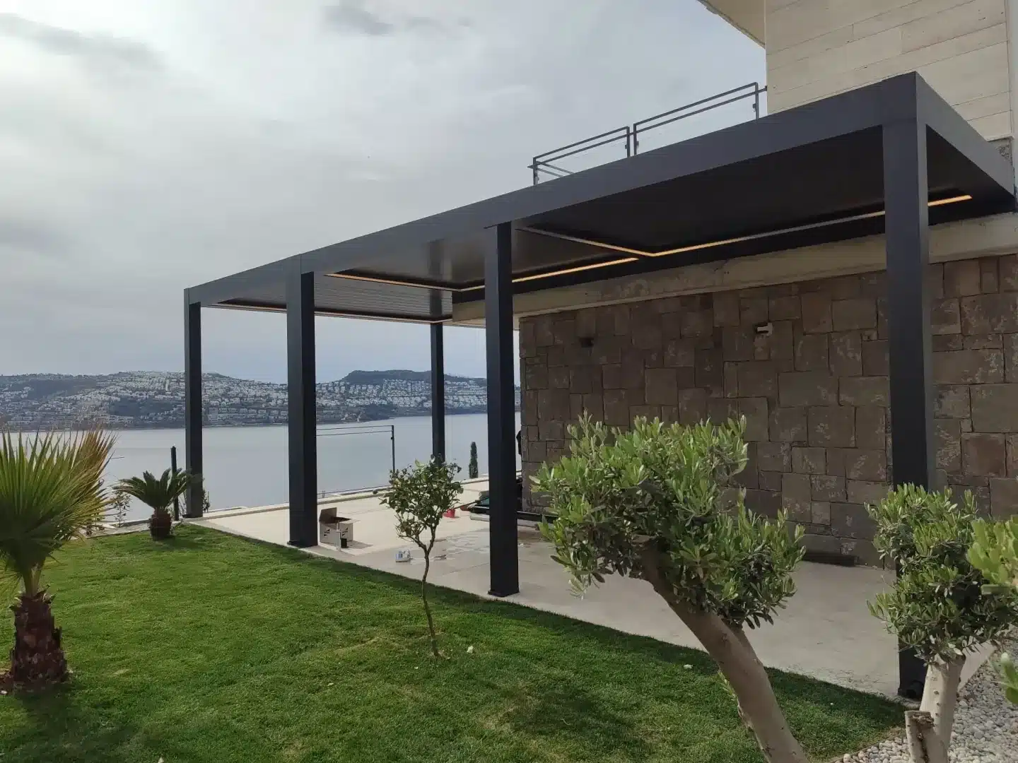 Louvred pergola beside a pool