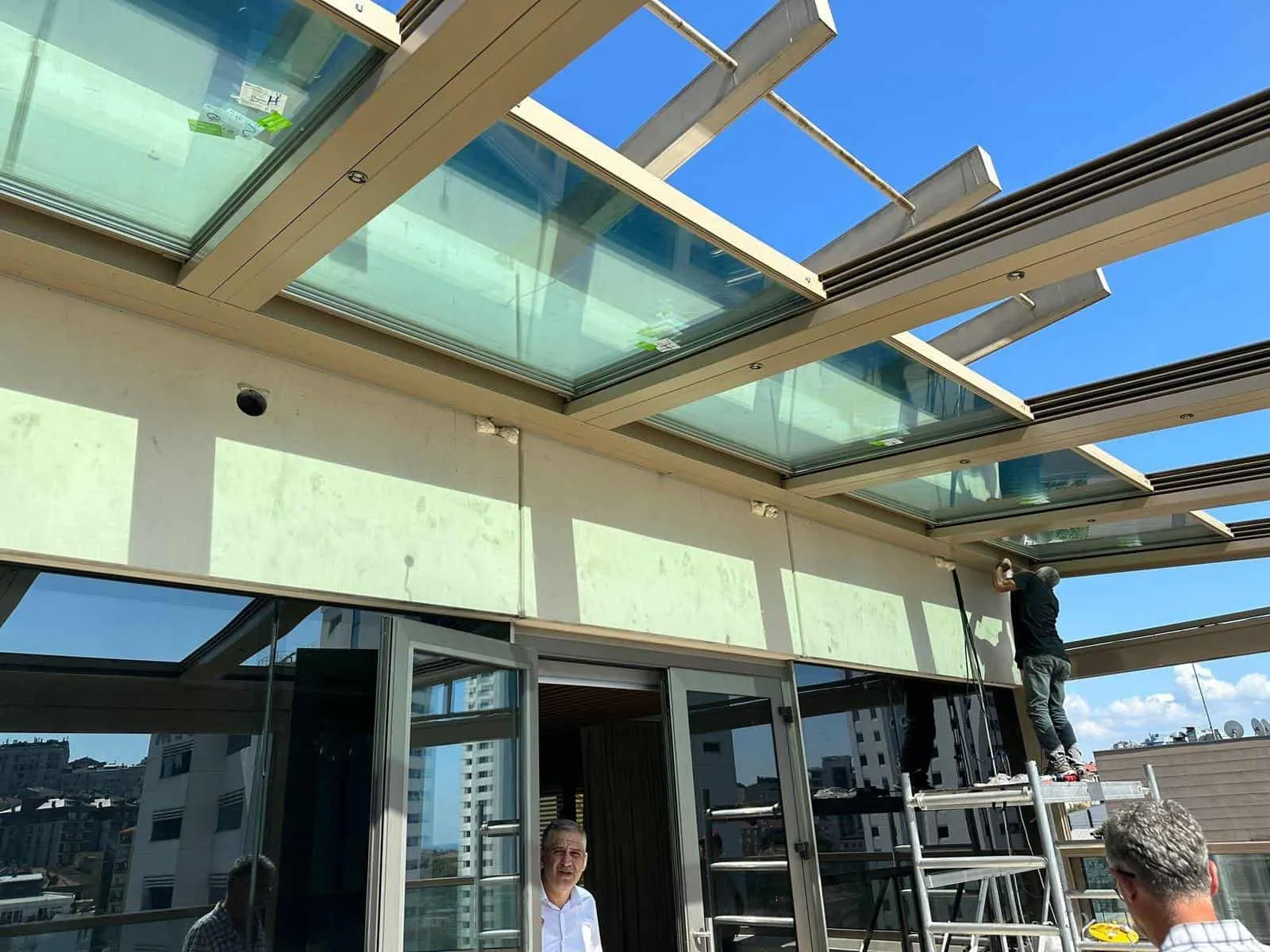 Moving glass roof panels seen from below