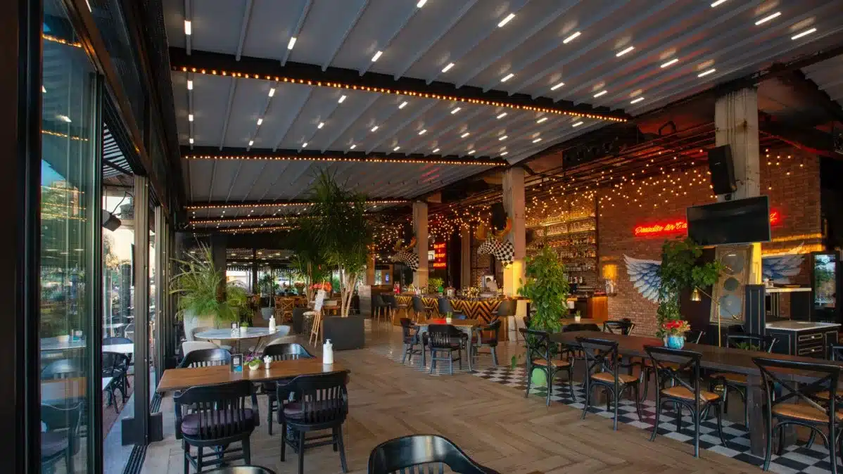 Retractable pergola roof with evening lighting